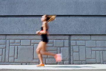 Naadloos Fotobehang Airtex Hardlopen Young woman jogging outdoors, motion concept  © sata_production
