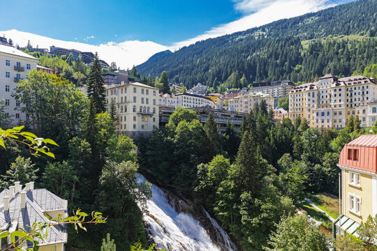 Scenic view of Bad Gastein with Gastein Waterfall and Belle Epoque architecture in Austria's Gastein Valley.