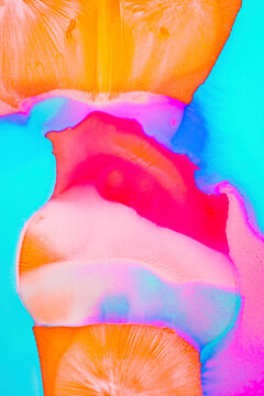Neon pastel inks blend in beautiful swirls creating an abstract design