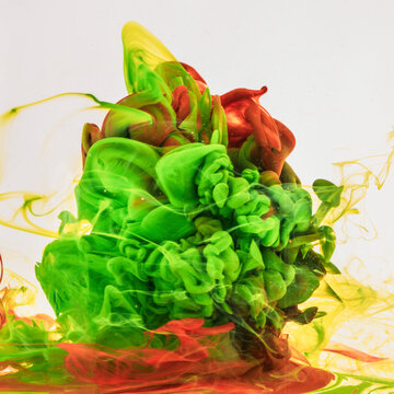 Vibrant ink tornadoes twist and blend within the water