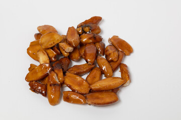 close up of pilinuts isolated against white.