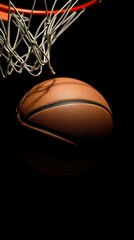 A basketball approaches the hoop in a dimly lit gym as players compete fiercely during a night match showcasing skill and intensity