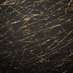 Dark textured surface with golden streaks.