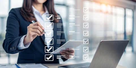 Professional woman checking tasks on a large screen monitor—great for productivity, business, or digital project management visuals.