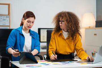 Creative digital development agency. developer team brainstorming on project with laptop, smartphone and digital tablet.