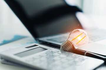 Bright Idea for Business Planning with Laptop and Calculator