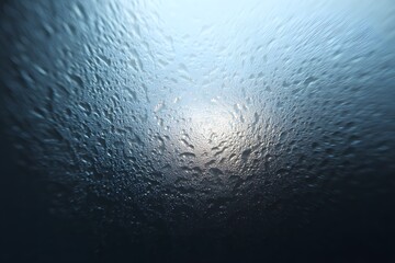 Water droplets on glass : A mesmerizing display of condensation on glass, with water droplets creating a unique texture, reflecting the soft glow, evoke a sense of tranquility and minimalist beauty