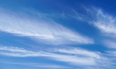 soft white clouds against a blue sky