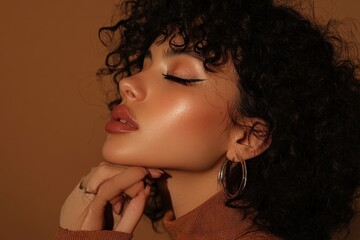 Fototapeta premium Elegant young Latin woman poses gracefully with natural makeup and curly hair surrounded by warm tones in a stylish urban setting during the golden hour