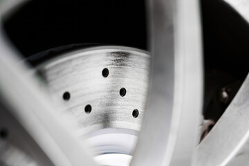 Closeup of Drilled Performance Disc Brake Rotor on Car Wheel