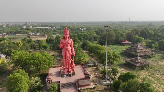An Aerial Shot of 101 foot tall, Hanuman Statue at Chhatarpur Temple, New Delhi, India
