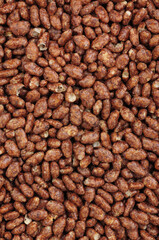 Chocolate flavour crisped rice grain breakfast cereal food detail background