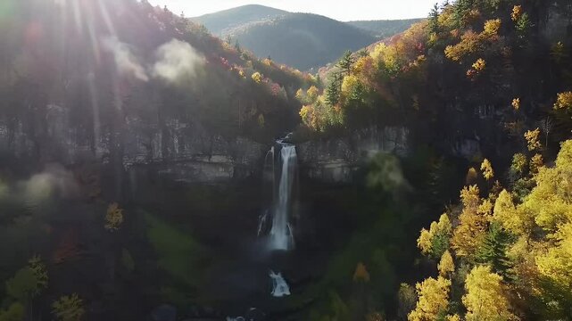 Beautiful waterfall in autumn mountains
