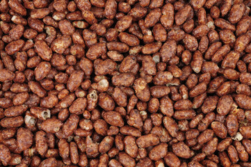 Chocolate flavour crisped rice grain breakfast cereal food detail background