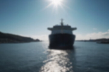 Obraz premium blurry harbor, bright ship harbor, exposed to morning sunlight, large ships are seen docked at the harbor pier, wallpaper, blurry background.