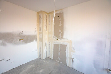 Assembled plasterboards on wall of an unfinished edifice on the building site