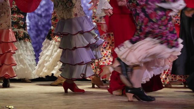 Professional flamenco dancers performing passionately in the in fair. Street performance. Traditional Spanish costumes