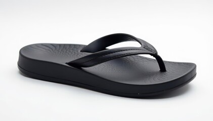 Single black flip-flop on white background, studio shot, leisure, detail