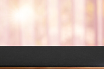 Empty wooden tray on perspective wooden table on top over blur flower background. Can be used mock up for montage products display or design layout.