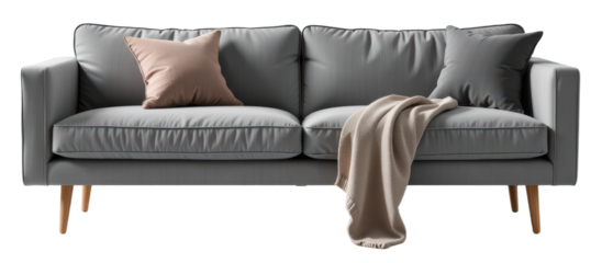 Modern gray sofa with two cushions and a draped beige throw blanket.