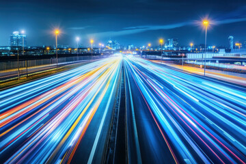 Fototapeta premium Busy night traffic on city streets and highways with motion and lights