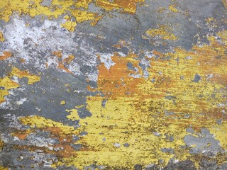 Abstract Texture of Peeling Yellow Paint on Concrete