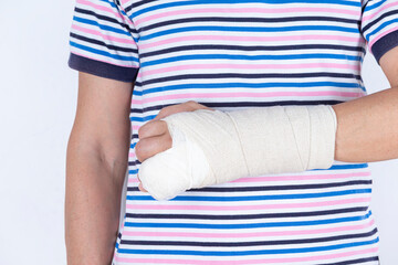 Medical Concepts. Closeup of Caucasian Man Damaged Broken Hand In Plaster and Bandaid Isolated on White Background