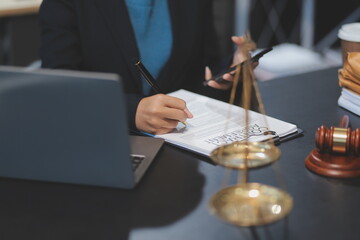 female business woman lawyers working at the law firms. Judge gavel with scales of justice. Legal law, lawyer, documents, advice and justice concept.