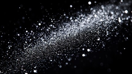 Obraz premium A black and white photograph of a snowflake against a black background.