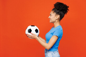 Side profile view young happy woman fan wears basic blue t-shirt cheer up support football sport...