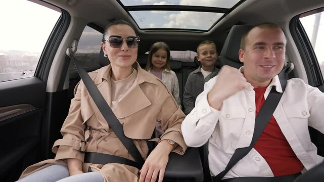 Family members dancing, singing, and enjoying upbeat music during vibrant road trip experience, creating joyful memories together in comfortable vehicle