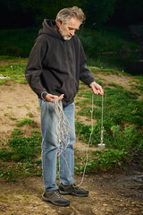 Senior citizen fishing with magnet in city lake found guns