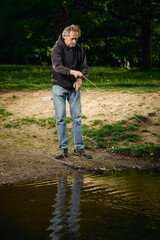 Senior citizen fishing with magnet in city lake found guns