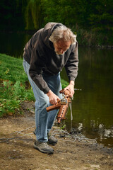 Senior citizen fishing with magnet in city lake found guns