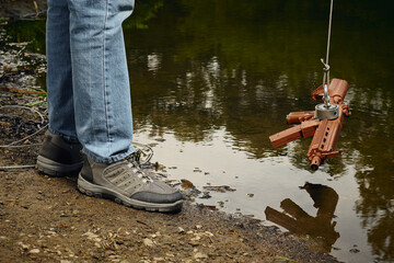 Senior citizen fishing with magnet in city lake found guns