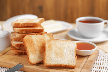 Slices of tasty toasted bread and jam on table, closeup