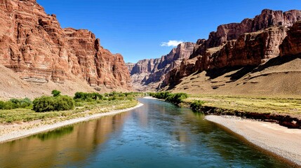 Scenic River Winding Through a Red Rock Canyon Under a Vivid Blue Sky