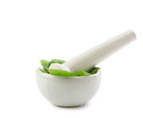 Fresh lemon balm leaves and pestle in mortar isolated on white