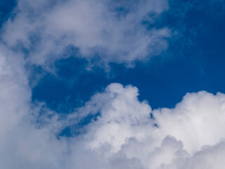 Fluffy White Clouds Against a Deep Blue Sky