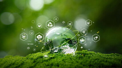 Crystal globe glass on green in forest with icon of Sustainable Development, green business, circular economy, supply chain, . renewable energy, carbon emission to net zero. Earth Day, and ESG concept