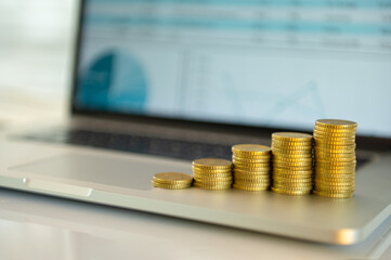 Interest rate and dividend from investing concept. money and return on investment and mutual funds portfolio on screen computer show to finance and investment growth.