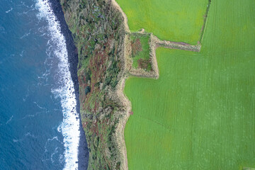 aerial top down drone image of a cliff on the north coast of the island of Sao Miguel. Azores...