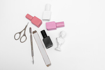 Nail Polish and Manicure Tools on White Background