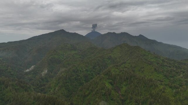 Aerial drone view of an active volcano erupting ash cloud in east java indonesia
