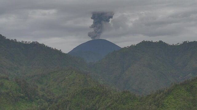 Aerial drone view of an active volcano erupting ash cloud in east java indonesia