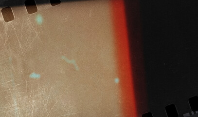 Abstract film strip texture dusty and grungy with light leak suitable for overlay and color cast...