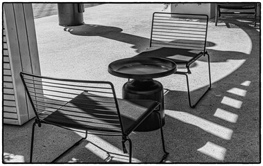 Minimalistic art cafe with black chairs