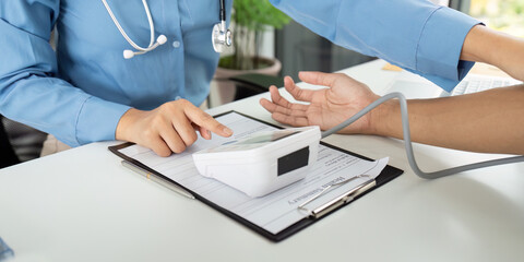 Health and Wellness: Doctor Monitoring Patient's Blood Pressure
