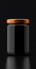 Fototapeta premium Black jar with orange lid with dark background.
