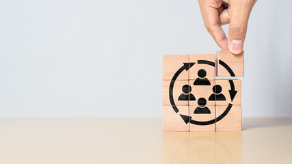 Manpower planning and management concept. Forecasting future staffing needs, analyzing current staffing levels and developing human resource strategies. Wooden blocks with manpower or staffs icons